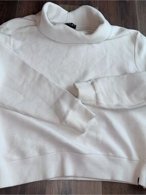 Varley Black Logo Tag on Cream Fabric